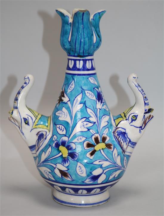 An Islamic fritware tulip vase, 24cm